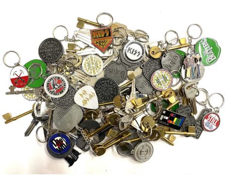 A large quantity of metal keyrings of music interest, to include: - The Beatles - KISS - Def Leppard - Pink Floyd - Coldplay 