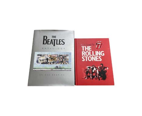 A pair of music-related coffee table books, to include: - The Beatles Anthology by the Beatles - According to the Rolling Sto