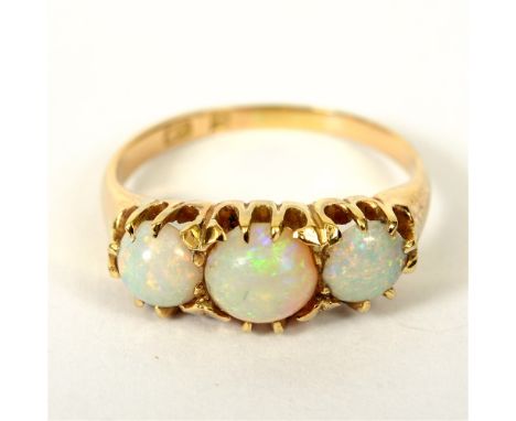 A THREE STONE OPAL RING  circa 1900, part of marks lost due to repair to the shank, finger size O 1/2, 4g gross.