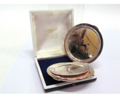 A SILVER POWDER COMPACT maker S. Ltd, possibly Stratton ?, Birmingham 1975, circular with engine turned and leaf engraved dec