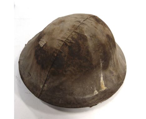 A SECOND WORLD WAR BRITISH ARMY HELMET  dated 1939, complete with liner, dated 1938, and cover.