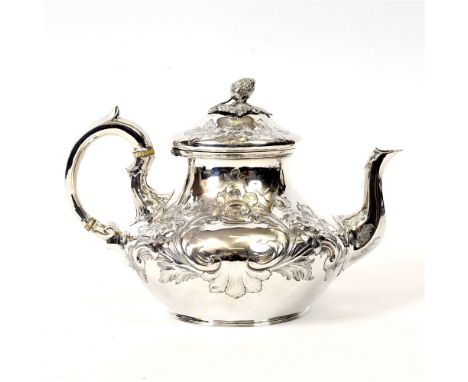 A VICTORIAN SILVER TEAPOT  by William Smily for A.B. Savoy & Sons, London 1855, of baluster form, embossed with foliage, 25cm