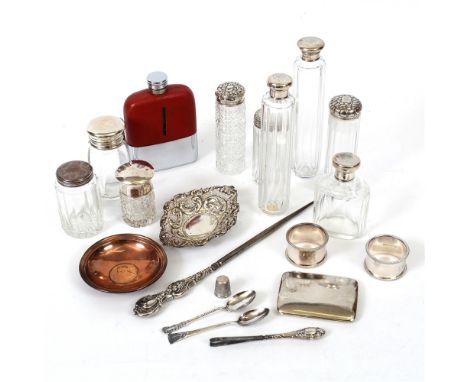 A COLLECTION OF SEVEN SILVER TOPPED TOILET BOTTLES an unmarked example; a metal topped toilet bottle; a silver cigarette case