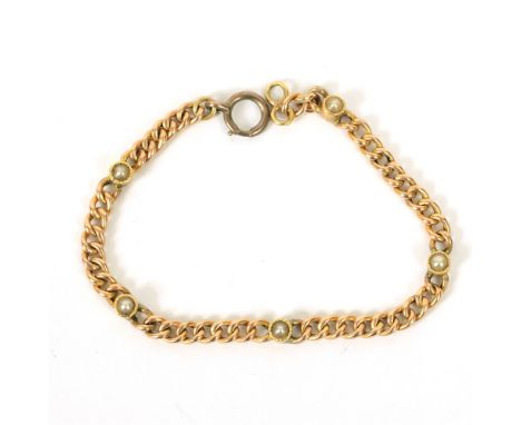 AN EDWARDIAN SEED PEARL BRACELET  the hollow curb links, punctuated at internals by fine millegrain set seed pearls, later re
