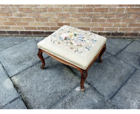 A TAPESTRY UPHOLSTERED STOOL  on carved walnut cabriole supports, 60cm x 52cm, 40cm high