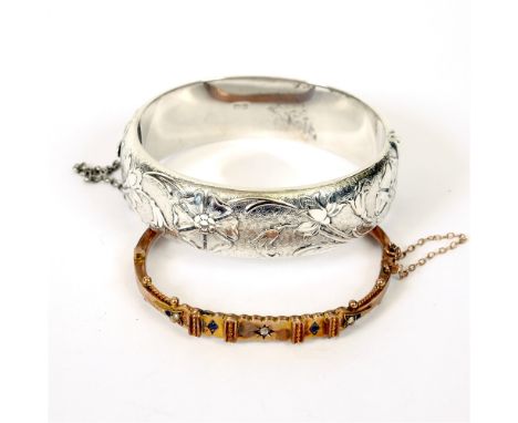 A LATE VICTORIAN 9 CARAT GOLD GEM SET HINGED BANGLE  7g gross, with a silver hinged bangle, 53g gross.