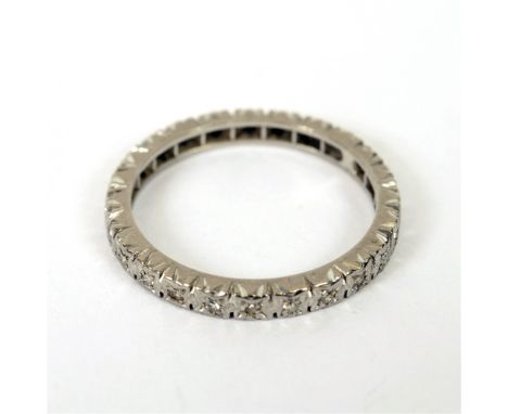 A DIAMOND FULL ETERNITY RING  the white mount unmarked, set with single cuts, finger size P 1/2, 3g gross.