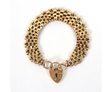 A 9 CARAT GOLD BRACELET  of gate links, to a padlock clasp, 18cm long, 17g gross.