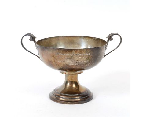 A FRENCH TWO HANDLED PRESENTATION CUP  French control marks, the bowl to a pedestal foot, 21cm across, 14cm high, inscribed '