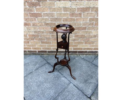 A 19TH CENTURY MAHOGANY WIG OR BASIN STAND  with soap dish and cover above single drawer, on cabriole supports, 80.5cm high