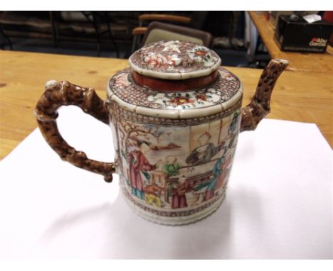 A CHINESE TEAPOT OF CYLINDRICAL FORM  the handle and spout naturalistically modelled as branches, polychrome enamelled decora