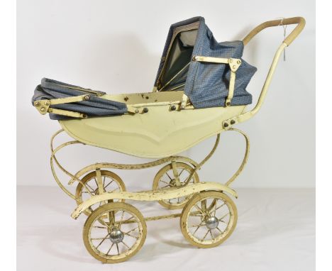 A vintage 1950's dolls pram.