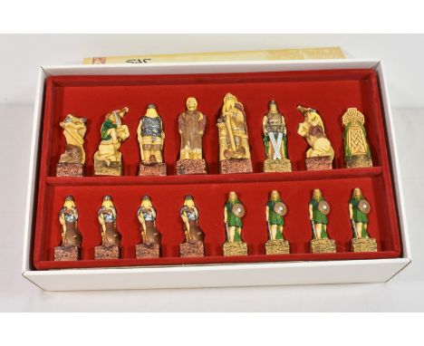 A Studio Ann Carlton 'The Celtic Chess Set' one side Celtic, the other Viking, resin with painted decoration, in the original