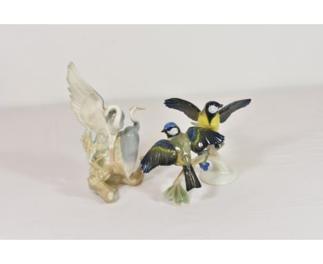 A Rosenthal porcelain figure of two blue tits on a branch 10 1/4in. (26cm.) wide, together with NAO storks figurine. (2)