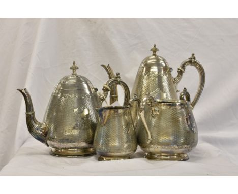 An unusual Victorian silver plate four piece coffee &amp; tea service of pear shape form , the main bodies with engine-turned