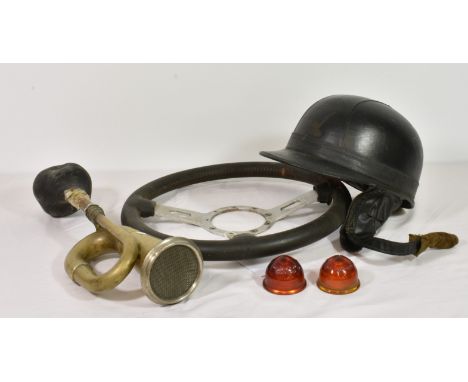 A 1950's "Everoak" black cork lined motorcycle helmet and Paddy Hopkirk steering wheel together with a vintage brass car horn