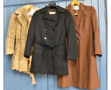 A vintage Saint Laurent Rive Gauche black double breasted jacket with belt together with a long brown Jaeger jacket and a Tis