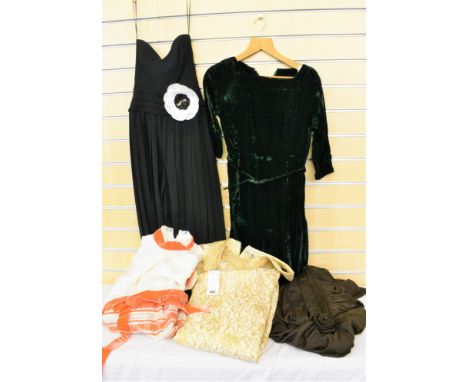 A quantity of vintage evening dresses consisting of a full length lace and velvet John Charles dress in striped orange, cream