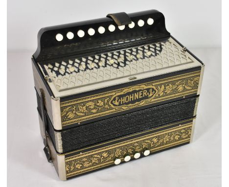 A vintage Hohner Accordion Marca Registrada in original card box - never used.
