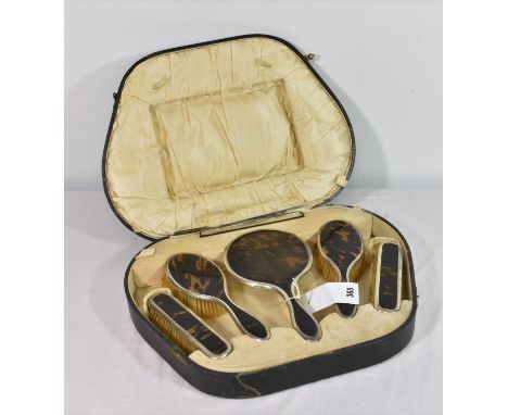 A George V silver and tortoiseshell dressing set in fitted case Horton &amp; Allday, Birmingham 1921, comprising a hand mirro