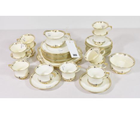 A Paragon Art Deco stylefine bone china part tea service, no. 695475, in a gilt and blue diamond pattern (38)