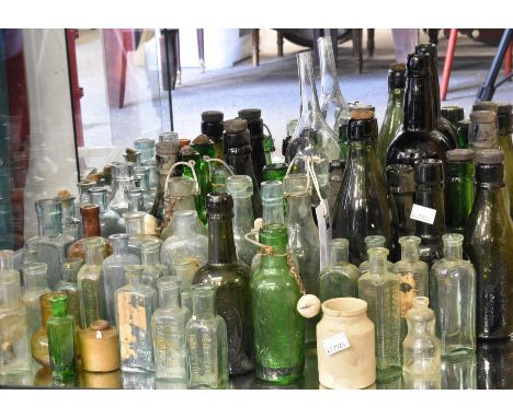 A large collection of vintage bottles.