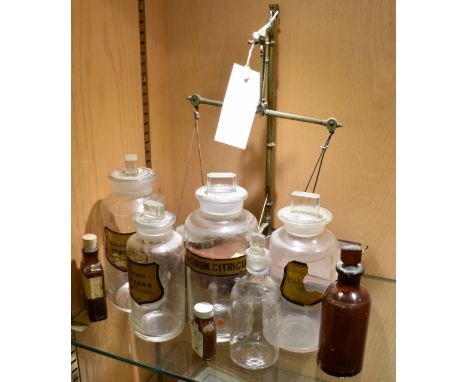 A set of apothecary beam balance scales by S. Maw son &amp; Sons ltd with weights, together with various apothecary jars etc.