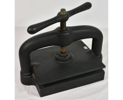 A vintage/antique cast iron book press