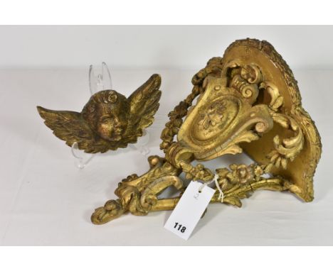 A 19th century giltwood and composition baroque wall bracket some losses; together with a 20th century carved giltwood cherub