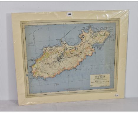 An Alderney Ordnance Survey map - revised from Air photographs Jan 1943 mounted.