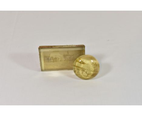A vintage celluloid paperweight - Channel Islands interest the arched rectangular paperweight with inner photograph depicting