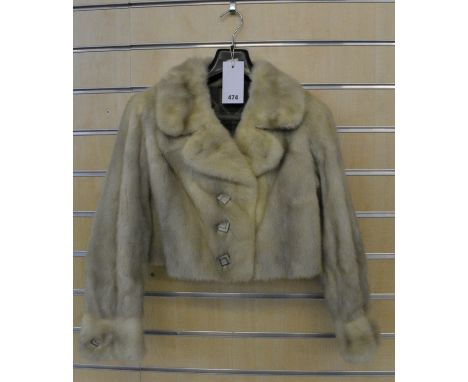 A vintage grey mink cropped jacket with cuffed sleeves and Art Deco style silver buttons.