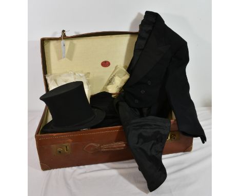 A vintage gentleman's tailcoat and collapsible top hat (a/f) together with a black dinner jacket and trousers, bowtie, shirts