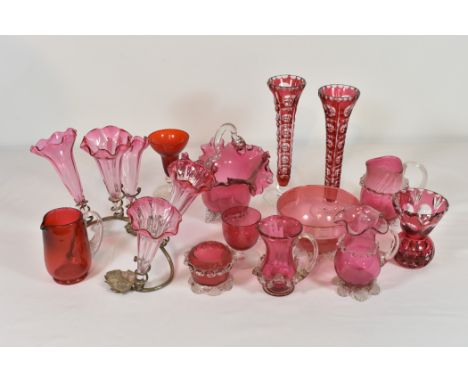 A collection of cranberry and Bohemian ruby cut glass comprising of a cranberry glass table centrepiece with metal foliate st