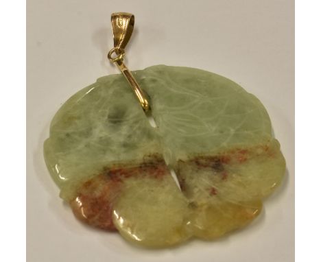 A modern carved jade fish pendant.   
