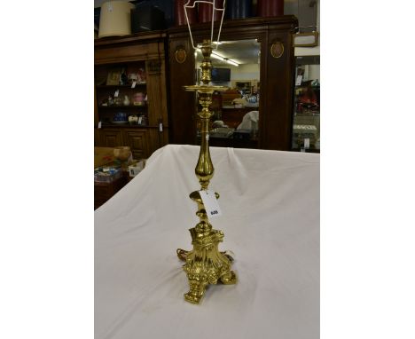 A brass altar style candlestick table lamp. 