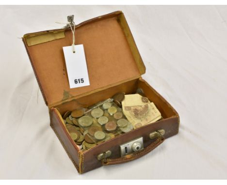 A collection of vintage coinage in a miniature leather suitcase. 