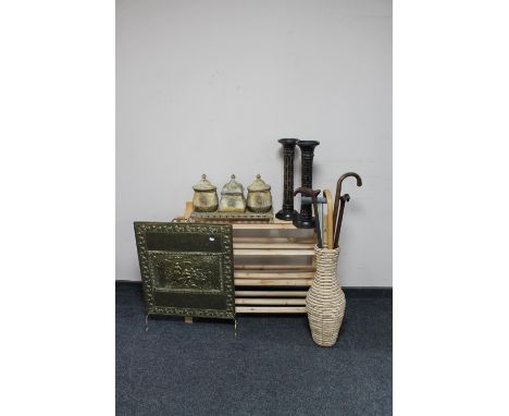 A set of pine open shelves together with a wicker vase containing walking sticks, brass embossed fire screen, three contempor