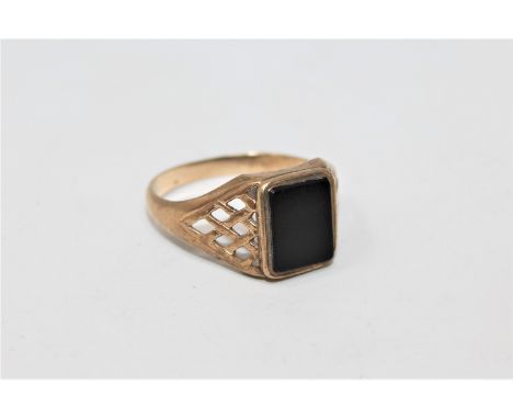 A 9ct gold signet ring set with black onyx CONDITION REPORT: 2.9g. Slightly misshapen. 