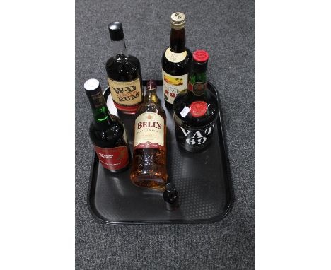 A 1 litre bottle of Bell's Scotch whisky, vintage bottle of Vat 69 Finest Scotch whisky, two further bottles of rum, bottle o