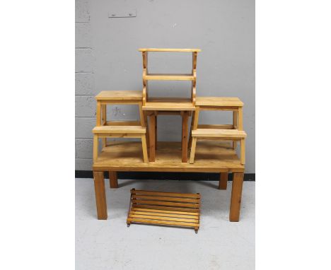 A pine coffee table, two sets of pine stool steps, two pine side tables and a wall shelf 