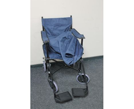 A folding light weight wheel chair in carry bag 