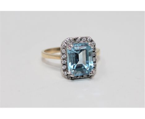 A blue topaz and diamond ring 