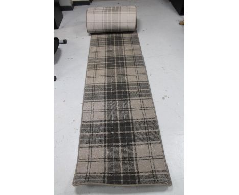 A tartan patterned hall runner 