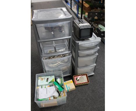 Two plastic storage chests containing extension leads, remote controls, light bulbs etc together with a Clipper radio, Perdio