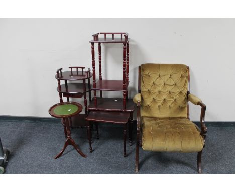 A mahogany armchair upholstered in gold button dralon, two telephone stands, nest of two tables and leather topped wine table