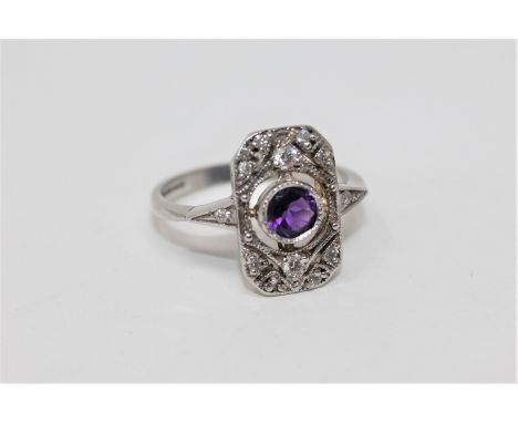 A 9ct gold amethyst and diamond ring