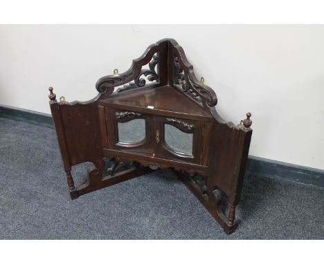 A Victorian mahogany double door corner shelf 