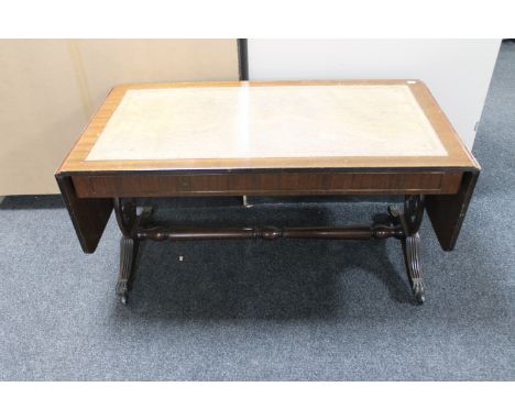 A mahogany flap sided leather inset sofa table 