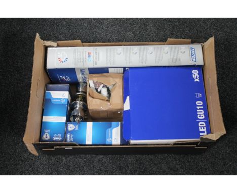 A box of LED light bulbs, converter fittings, two Oral B electric toothbrushes, Triton boxed mixer shower 